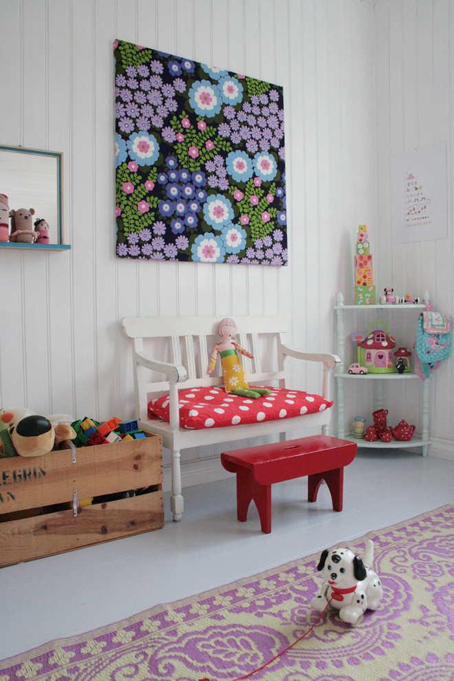 Scandinavian kids' room in Other with white walls, painted wood floors and grey floor for girls.