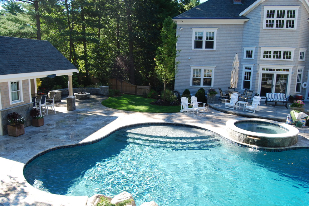 Mid-sized mountain style backyard stone and kidney-shaped natural water slide photo in Boston