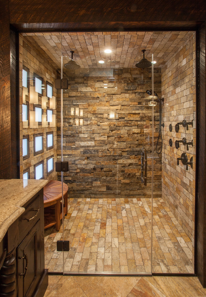 Mid-sized country master bathroom in Other with recessed-panel cabinets, dark wood cabinets, a curbless shower, a two-piece toilet, beige tile, stone tile, beige walls, travertine floors, an undermount sink and engineered quartz benchtops.