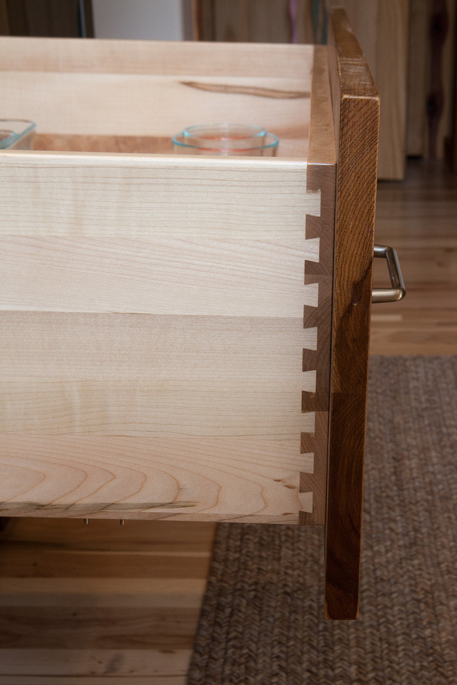Inspiration for a rustic kitchen remodel in Indianapolis with flat-panel cabinets and medium tone wood cabinets