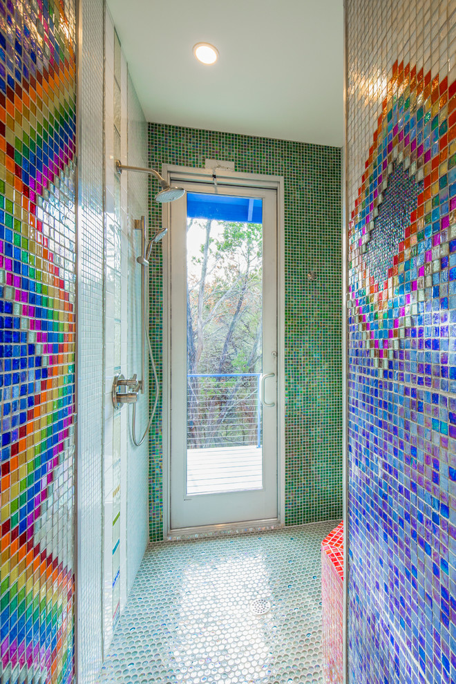 Design ideas for a mid-sized eclectic bathroom in Austin with flat-panel cabinets, white cabinets, an open shower, a one-piece toilet, multi-coloured tile, glass tile, multi-coloured walls and ceramic floors.