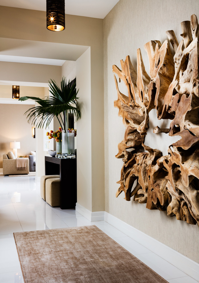 Mid-sized tropical hallway in Miami with beige walls, porcelain floors and white floor.