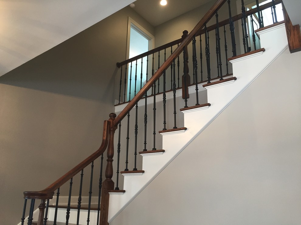 Design ideas for a mid-sized country wood l-shaped staircase in Chicago with painted wood risers.