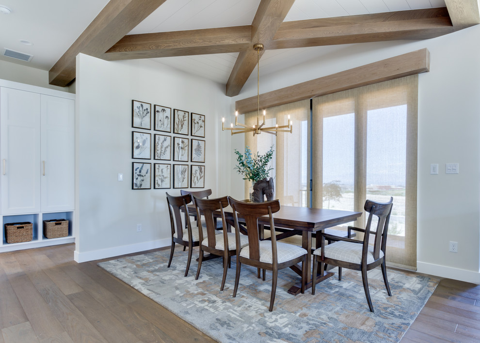 Photo of a country open plan dining in Salt Lake City with beige walls, light hardwood floors and no fireplace.