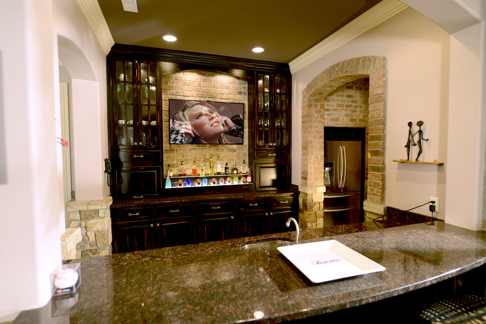 Design ideas for a large traditional open concept home theatre in Indianapolis with multi-coloured walls, brown floor, travertine floors and a wall-mounted tv.