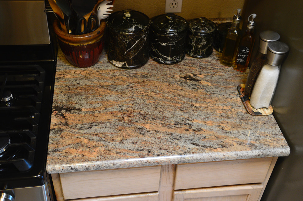 Inspiration for a small rustic single-wall ceramic tile enclosed kitchen remodel in Albuquerque with an undermount sink, granite countertops and no island