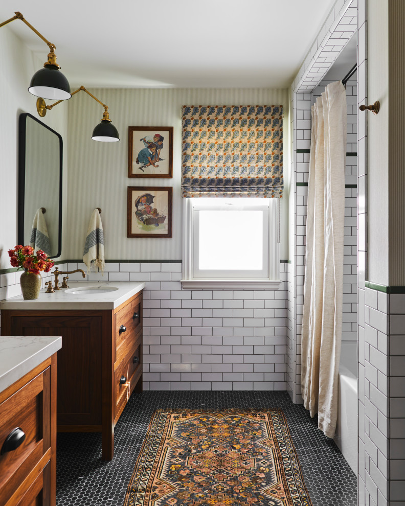 Inspiration for a traditional bathroom in San Francisco with shaker cabinets, dark wood cabinets, an alcove tub, a shower/bathtub combo, white tile, subway tile, green walls, mosaic tile floors, an undermount sink, black floor, a shower curtain, beige benchtops, a double vanity and a freestanding vanity.