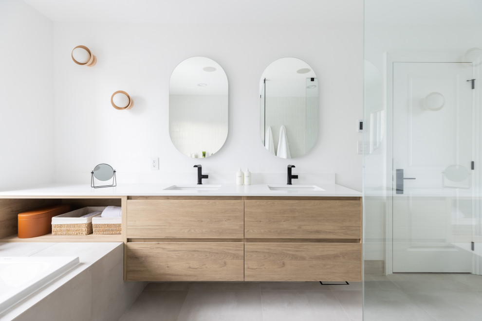 Design ideas for a large scandinavian master bathroom in Toronto with flat-panel cabinets, medium wood cabinets, an alcove tub, a curbless shower, white walls, porcelain floors, an undermount sink, quartzite benchtops, grey floor, an open shower, white benchtops, a double vanity, a floating vanity, a wall-mount toilet, white tile and mosaic tile.