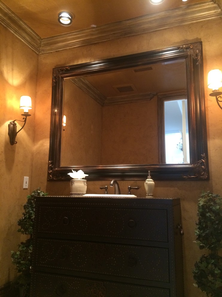 Photo of a large traditional 3/4 bathroom in Orange County with furniture-like cabinets, brown cabinets, yellow walls and marble floors.