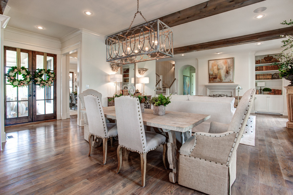 Inspiration for a large traditional open plan dining in Little Rock with white walls, medium hardwood floors and a corner fireplace.