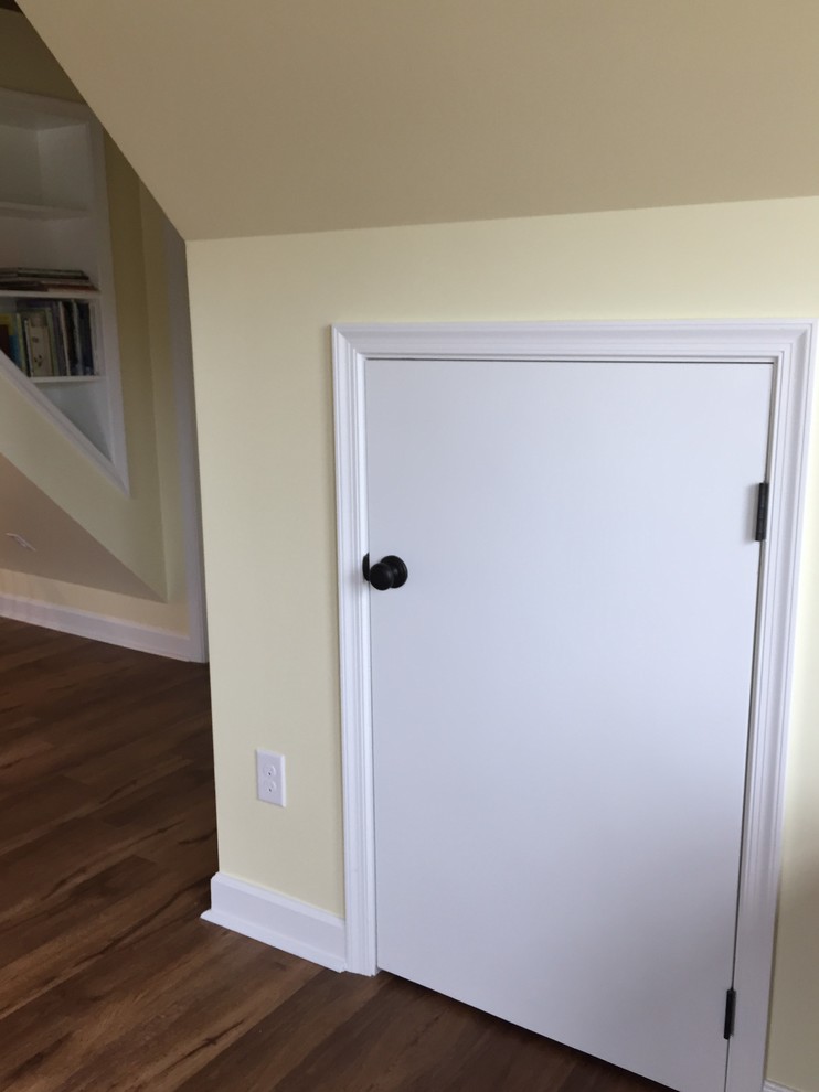 Inspiration for a large timeless loft-style vinyl floor home design remodel with yellow walls