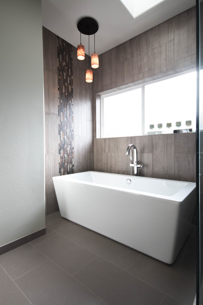 Inspiration for a large contemporary master bathroom in Portland with recessed-panel cabinets, brown cabinets, a freestanding tub, a double shower, a two-piece toilet, gray tile, ceramic tile, green walls, porcelain floors, an undermount sink and engineered quartz benchtops.