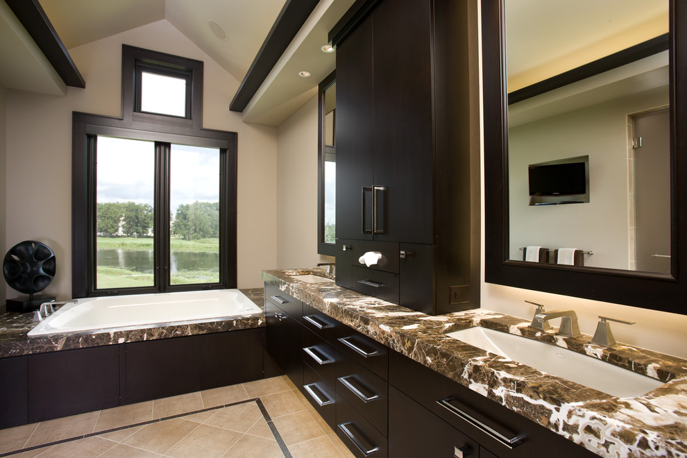 This is an example of a contemporary bathroom in Minneapolis with marble benchtops.