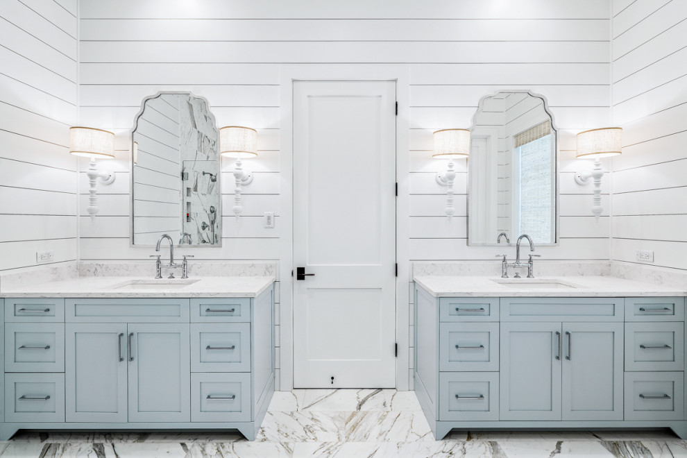 This is an example of a mid-sized beach style master bathroom in Miami with flat-panel cabinets, blue cabinets, an undermount sink, quartzite benchtops, white benchtops, a single vanity and a freestanding vanity.