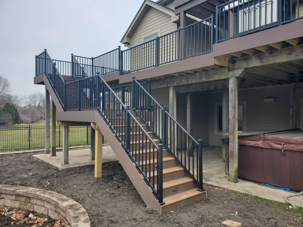Deck - large backyard second story metal railing deck idea with no cover