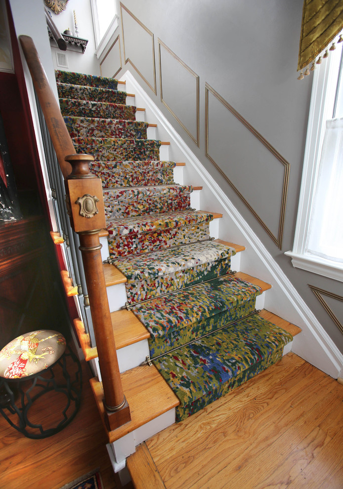 Small eclectic wood straight staircase in Detroit with painted wood risers and wood railing.