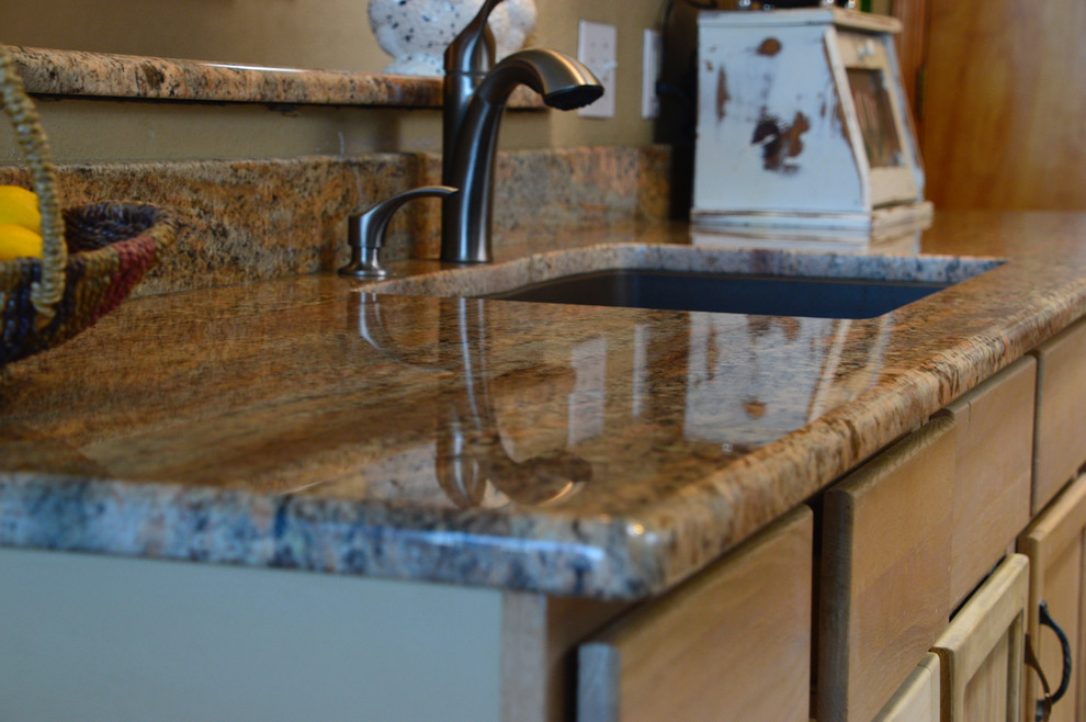 Example of a small transitional single-wall ceramic tile enclosed kitchen design in Albuquerque with an undermount sink, granite countertops and no island