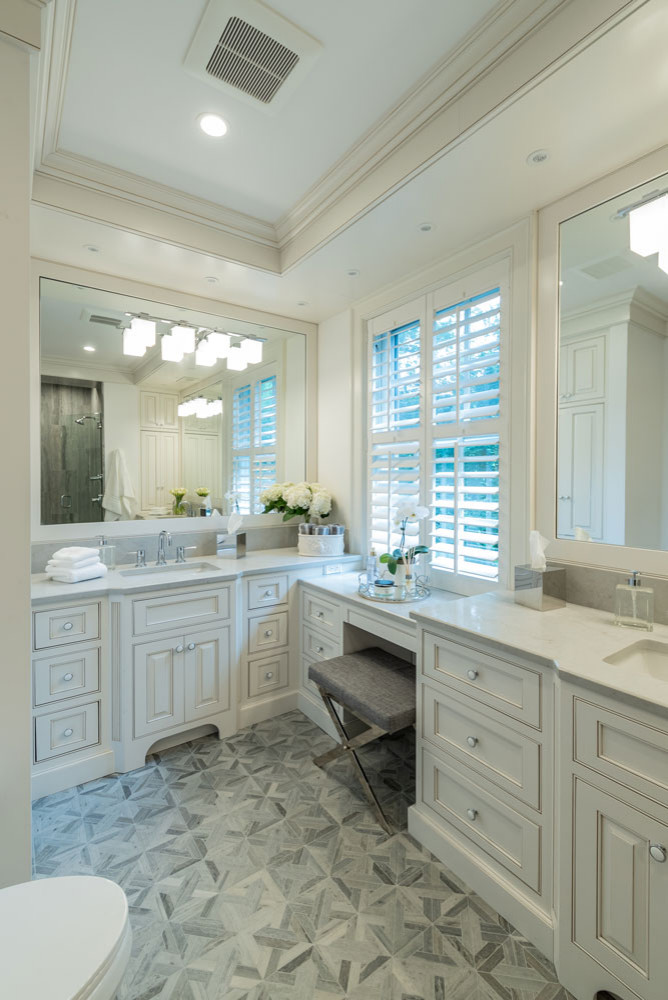 This luxury bathroom renovation blends timeless design with modern functionality, creating a calm, spa-like retreat tailored for everyday comfort. Custom inset cabinetry in a soft neutral finish provi