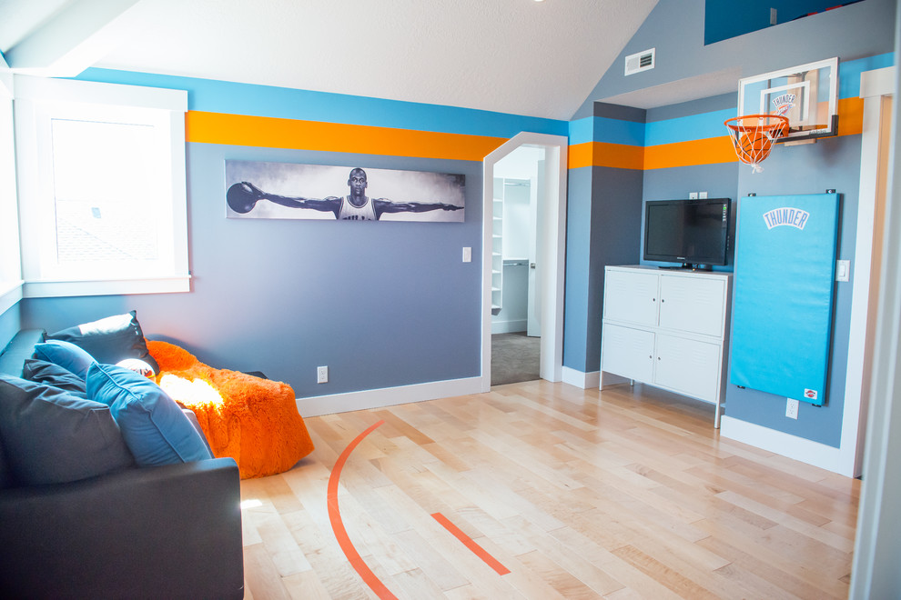 This is an example of a mid-sized arts and crafts kids' room for boys in Salt Lake City with light hardwood floors and multi-coloured walls.