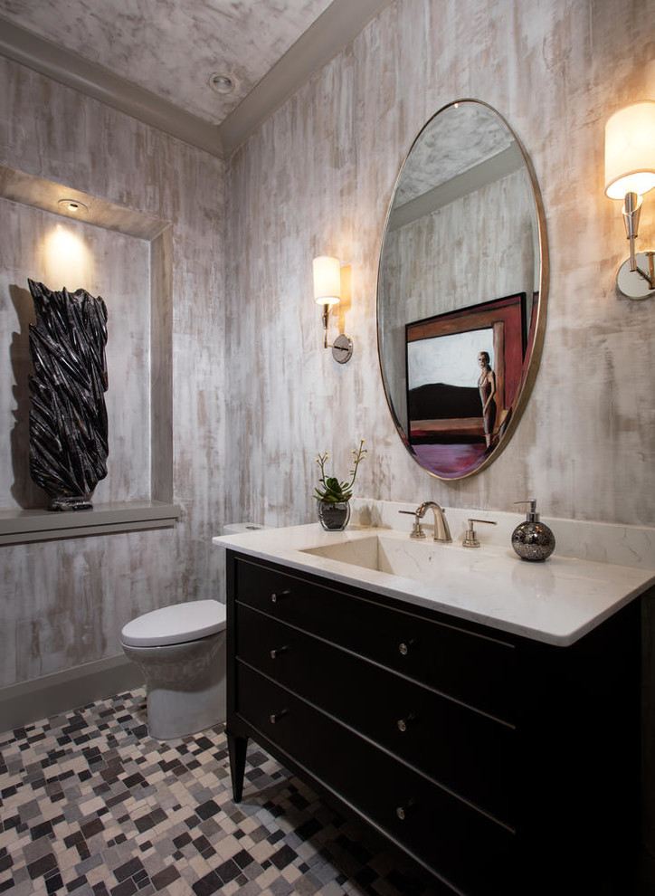 This is an example of a transitional powder room in Miami with furniture-like cabinets, black cabinets, multi-coloured walls, mosaic tile floors, an integrated sink and multi-coloured floor.