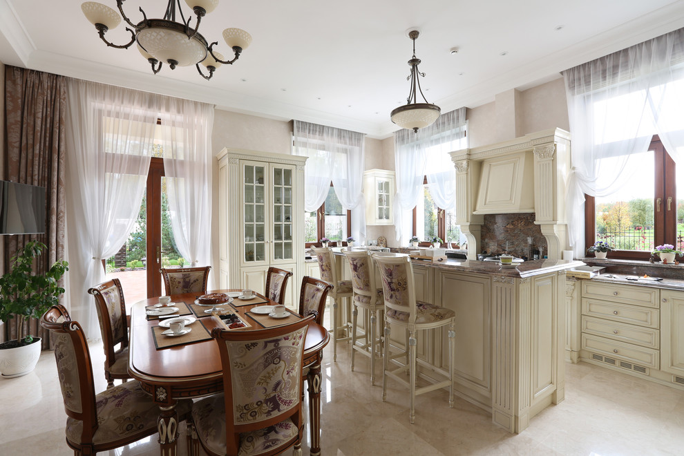 Traditional u-shaped eat-in kitchen in Moscow with white cabinets, with island and beige floor.