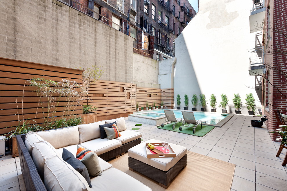 This is an example of a contemporary patio in New York with no cover.