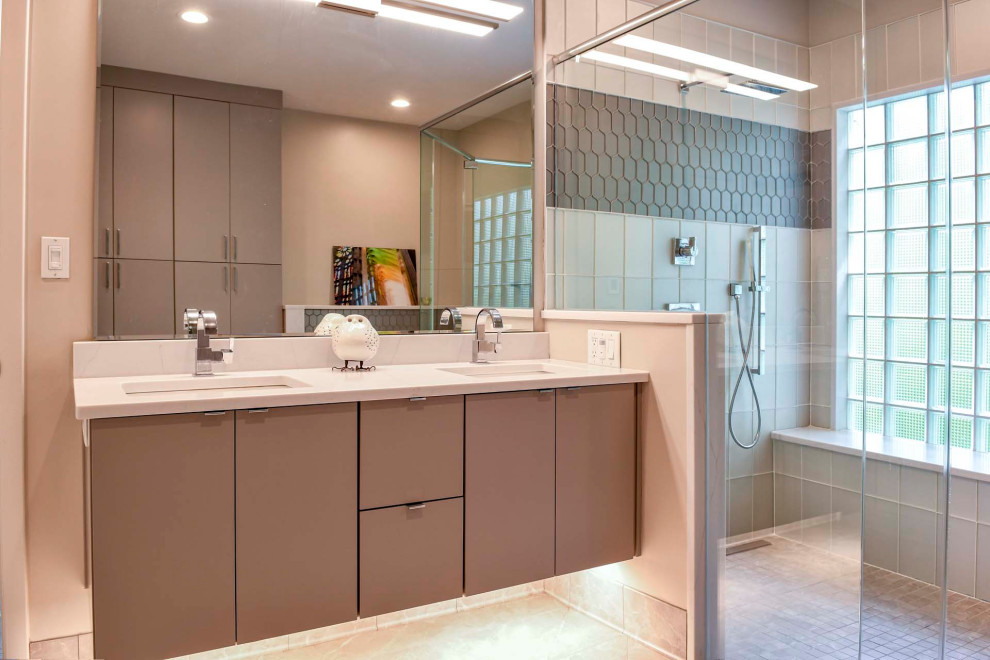 Design ideas for a contemporary bathroom in Louisville with flat-panel cabinets, grey cabinets, an alcove shower, gray tile, grey walls, mosaic tile floors, an undermount sink, grey floor, a hinged shower door, white benchtops, a shower seat, a double vanity and a floating vanity.