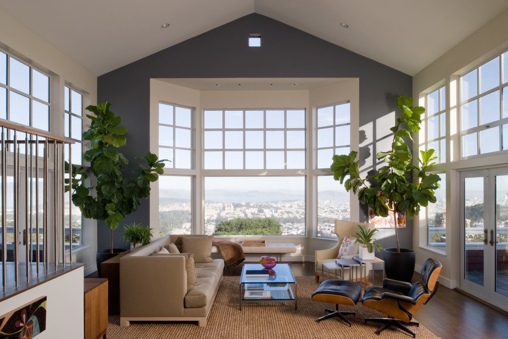 This is an example of a mid-sized transitional formal open concept living room in San Francisco with grey walls, dark hardwood floors, no fireplace and no tv.