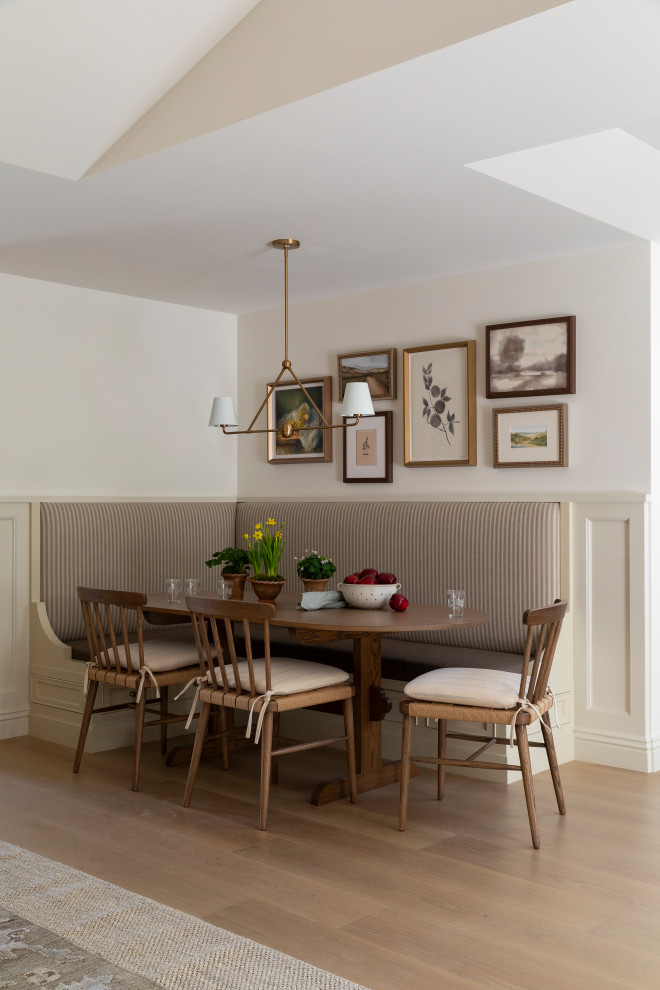 Breakfast nook - coastal medium tone wood floor, beige floor and wallpaper breakfast nook idea in Orange County