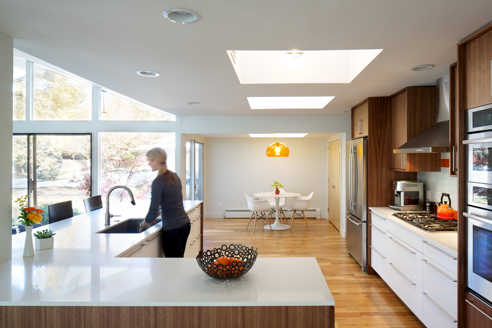 Midcentury kitchen in Denver with stainless steel appliances.