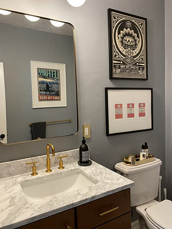 This is an example of a mid-sized modern 3/4 bathroom in Los Angeles with white cabinets, a single vanity, a built-in vanity, a one-piece toilet, white tile, marble, grey walls and a drop-in sink.