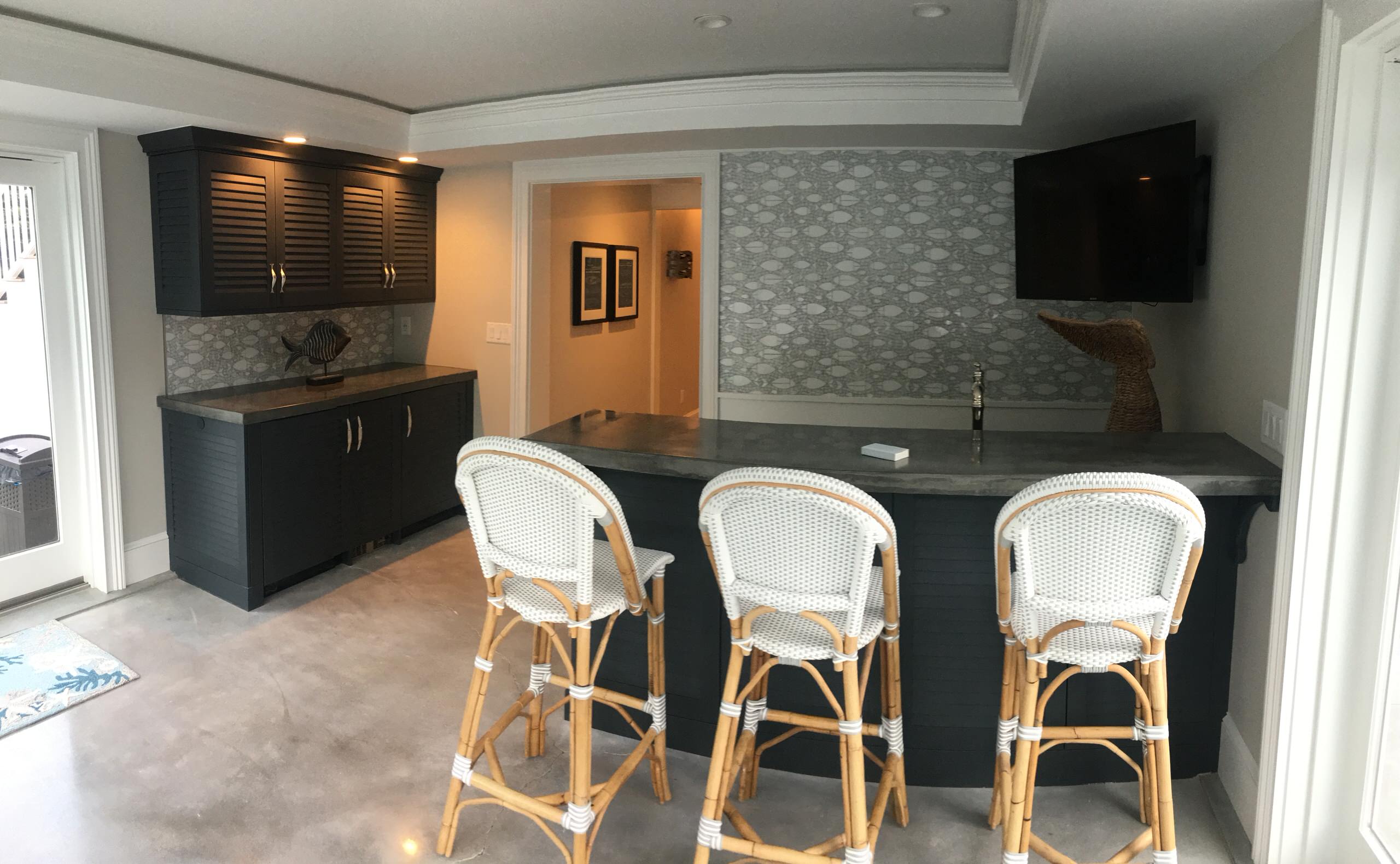 A fully equipped laundry room with a built ins