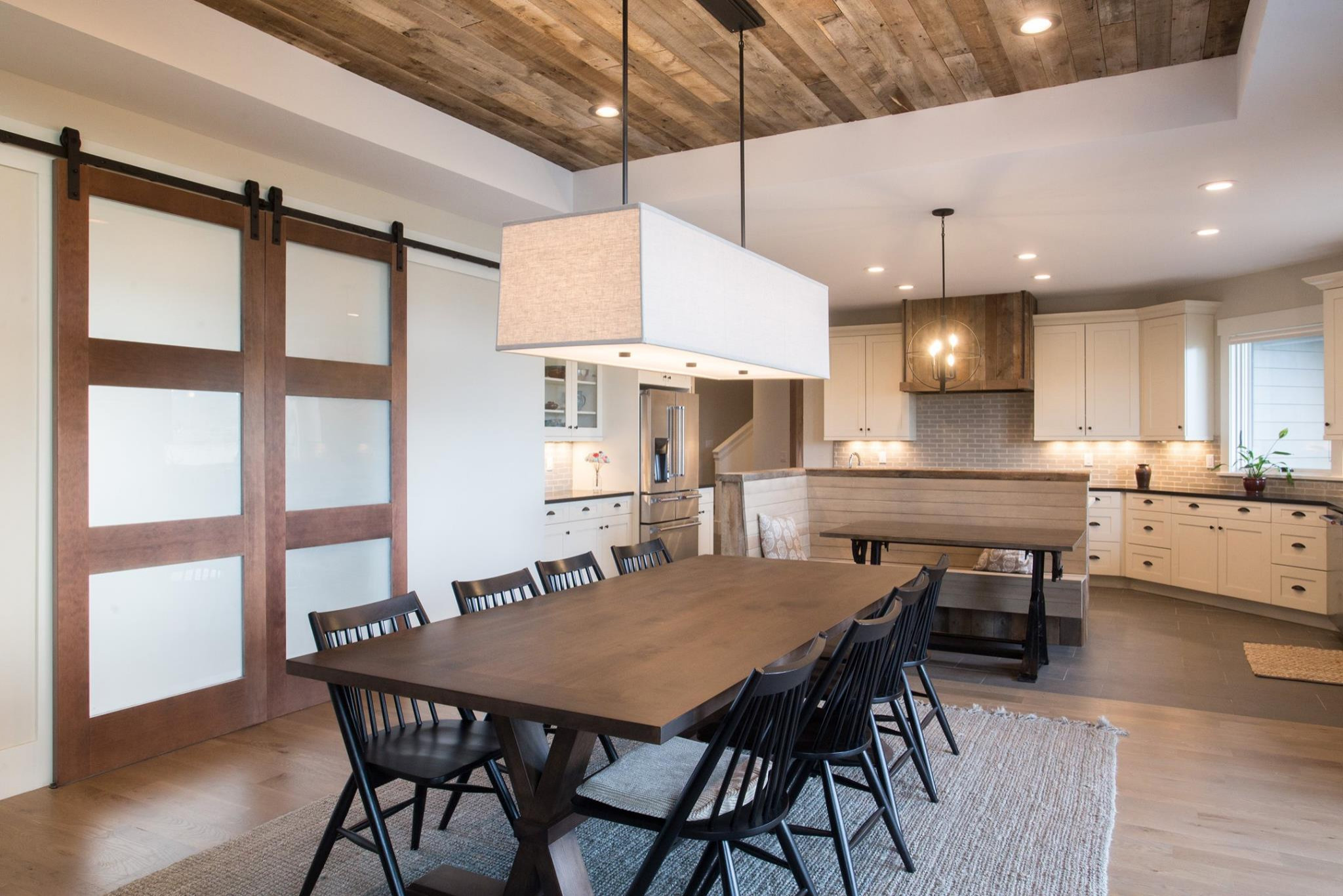 Banquette, Barn Wood Ceiling, Doors, Range Hood, and Trim Work by Black Diamond