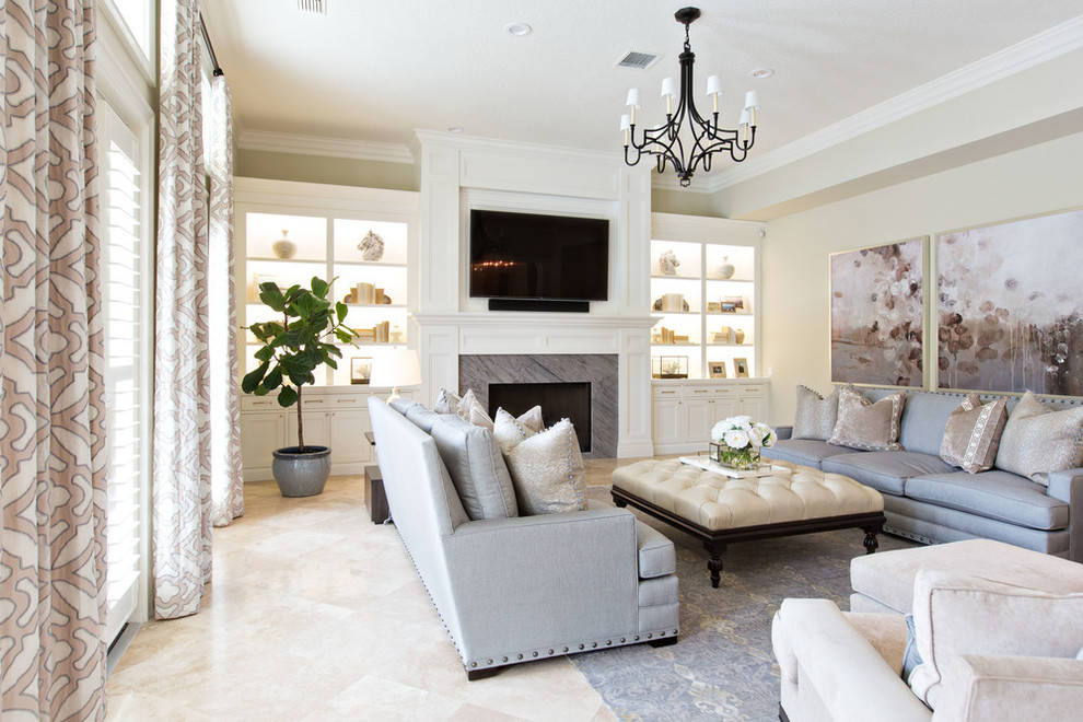 Inspiration for a transitional formal living room in Orange County with beige walls, travertine floors, a standard fireplace, a tile fireplace surround and a wall-mounted tv.