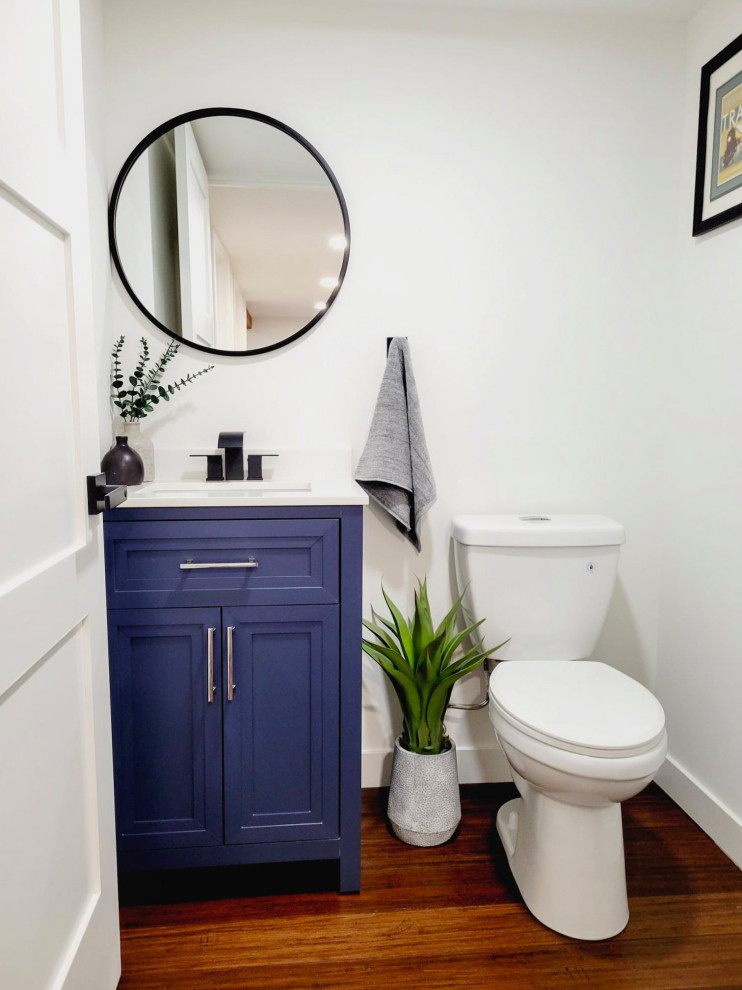 Design ideas for a small traditional cloakroom in Seattle with recessed-panel cabinets, blue cabinets, white worktops and a freestanding vanity unit.
