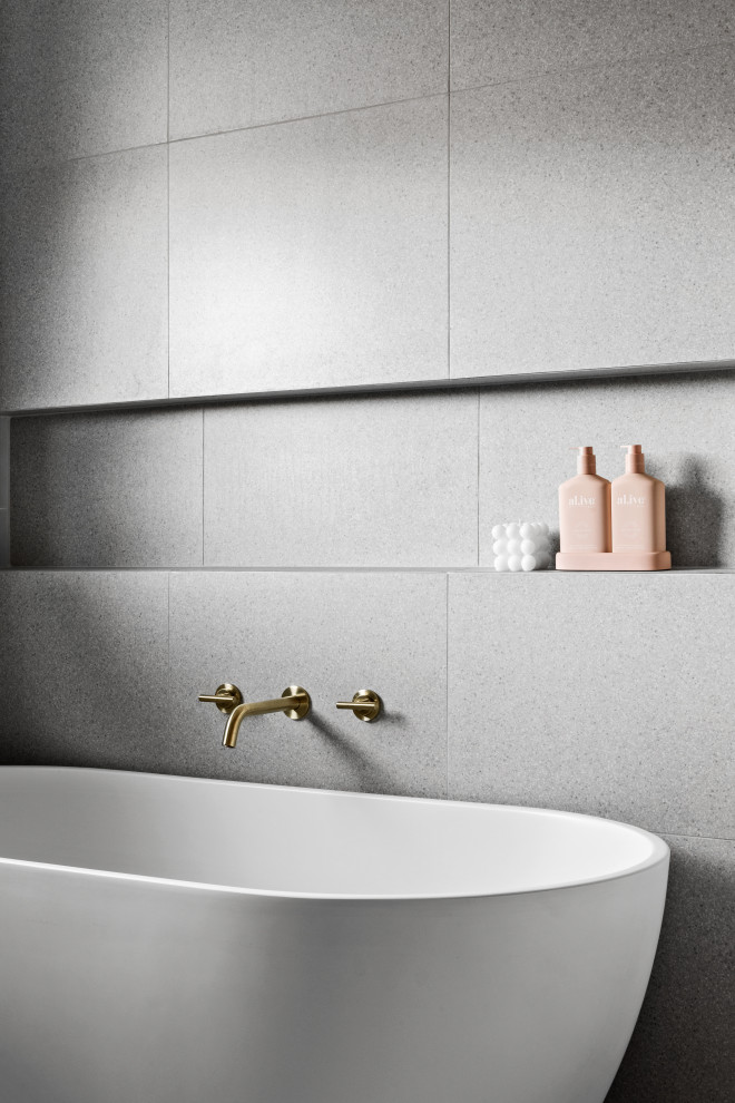Inspiration for a contemporary bathroom in Melbourne with beige cabinets, a freestanding tub, an open shower, green tile, ceramic tile, grey walls, ceramic floors, terrazzo benchtops, grey floor, an open shower, pink benchtops and a single vanity.