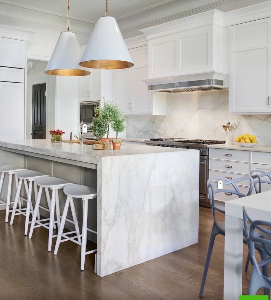 Example of a large trendy u-shaped dark wood floor and brown floor open concept kitchen design in Dallas with shaker cabinets, an island and white cabinets