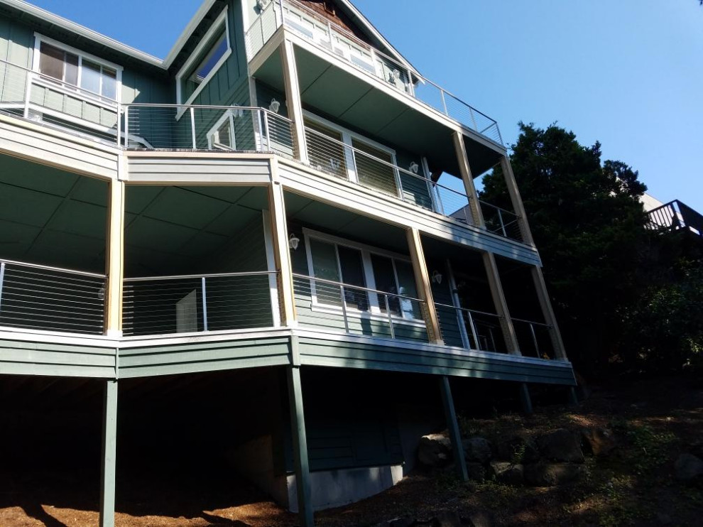 Inspiration for a large modern backyard deck remodel in Seattle with no cover