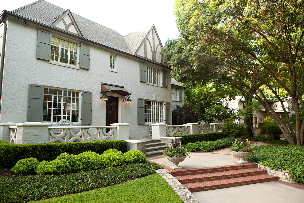 Photo of a large traditional two-storey brick exterior in Dallas.