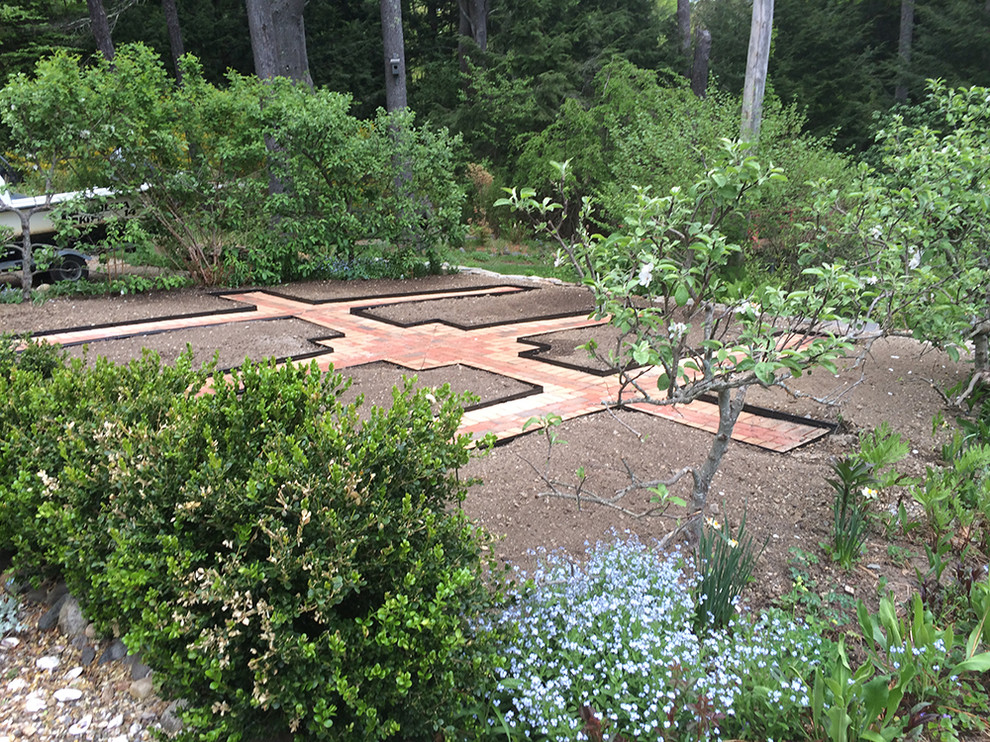 Design ideas for a small mediterranean side yard full sun formal garden for summer in Boston.