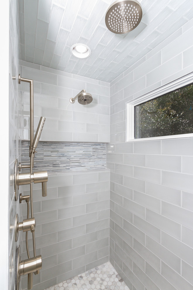 Inspiration for a transitional master bathroom in Charlotte with glass tile.