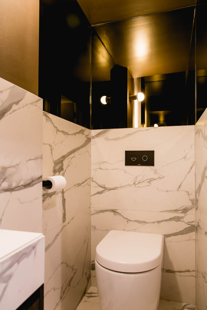 Inspiration for a small classic cloakroom in Melbourne with flat-panel cabinets, black cabinets, a wall mounted toilet, porcelain tiles, multi-coloured walls, marble flooring, a vessel sink, tiled worktops, multi-coloured floors, multi-coloured worktops and a built in vanity unit.