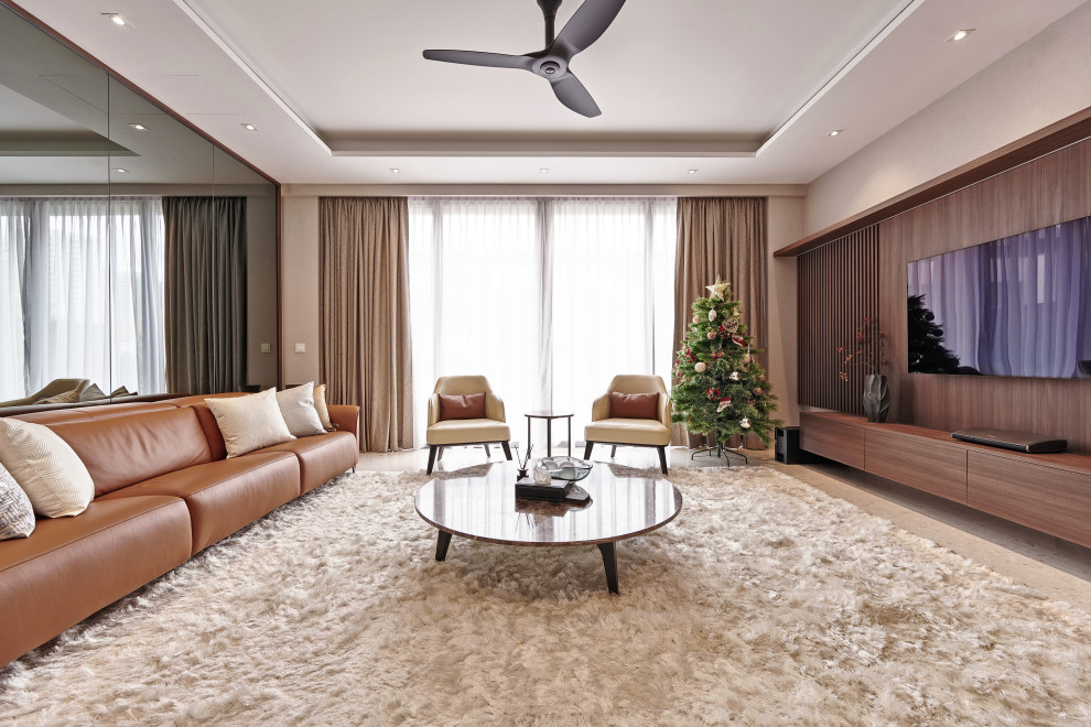 This is an example of a contemporary enclosed living room in Singapore with beige walls, no fireplace, a wall-mounted tv, beige floor and recessed.