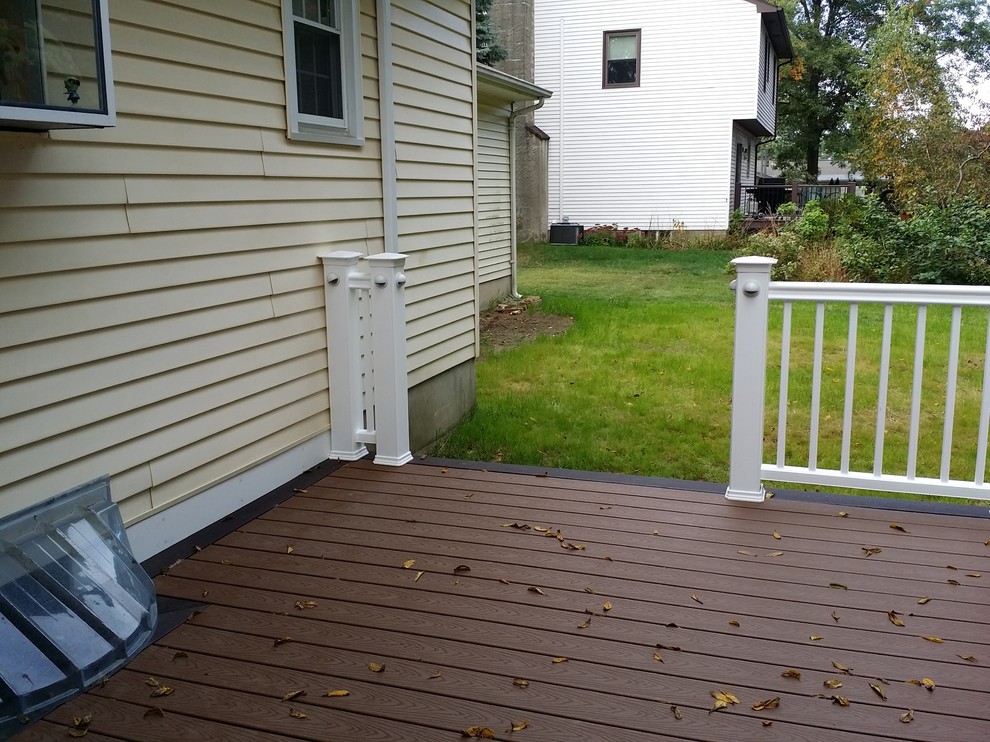 Photo of a small contemporary backyard deck in New York with no cover.