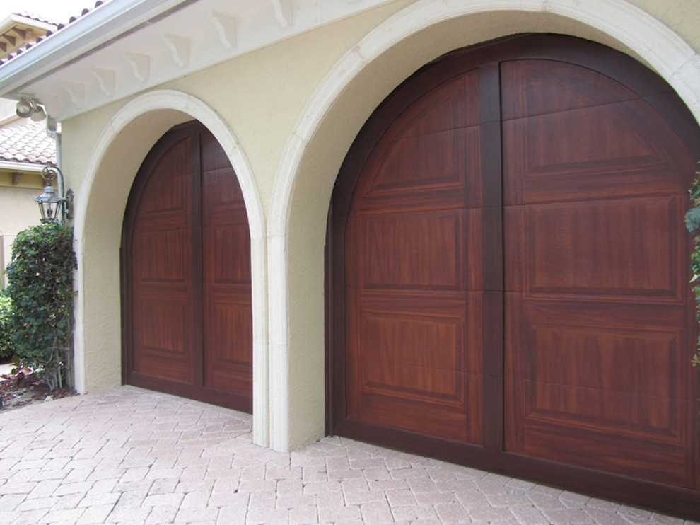 This is an example of a mid-sized tropical attached two-car carport in Miami.