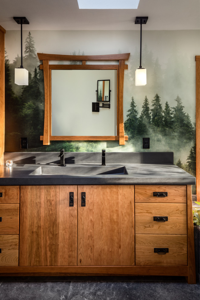 Design ideas for a mid-sized asian master bathroom in Other with flat-panel cabinets, medium wood cabinets, a drop-in tub, a curbless shower, porcelain floors, an integrated sink, concrete benchtops, grey floor, an open shower, a double vanity, a built-in vanity and wallpaper.