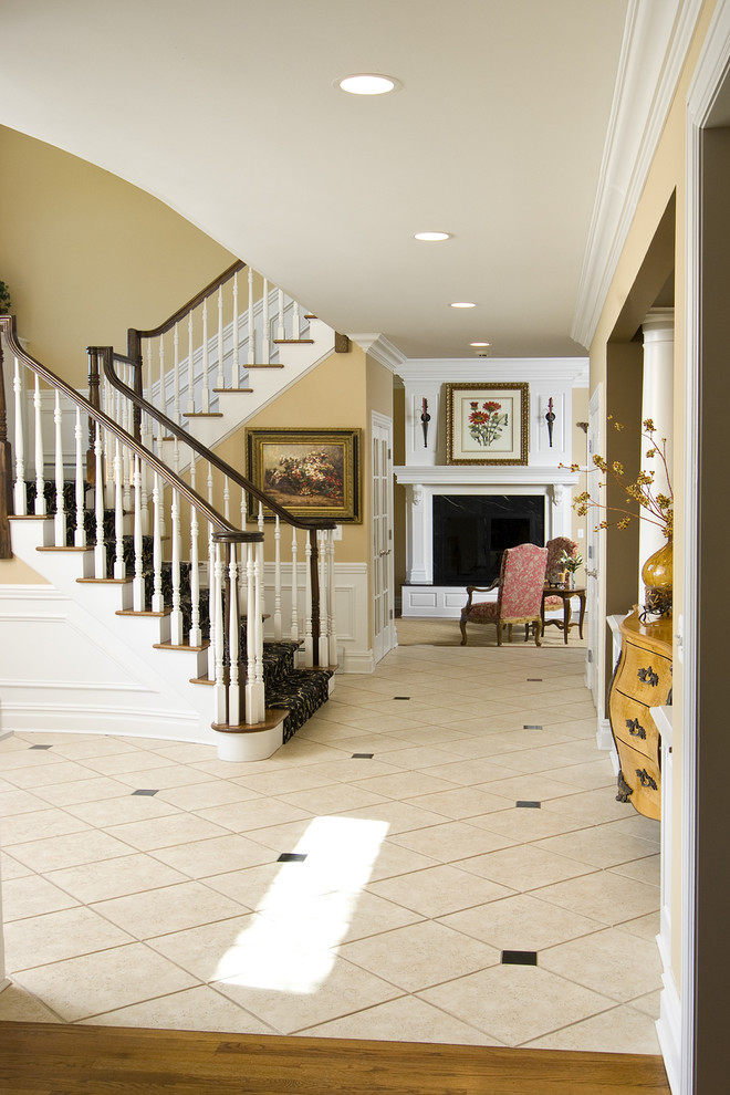 Design ideas for a traditional foyer in Newark with beige walls.