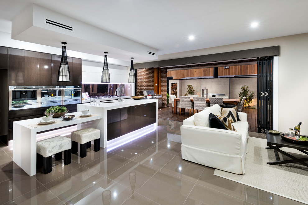 Photo of a large contemporary eat-in kitchen in Canberra - Queanbeyan with quartz benchtops, porcelain floors, with island, a double-bowl sink, flat-panel cabinets, dark wood cabinets, mirror splashback and stainless steel appliances.