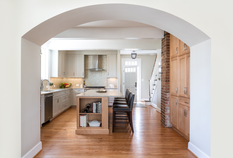 Inspiration for a mid-sized transitional galley medium tone wood floor eat-in kitchen remodel in DC Metro with an island, recessed-panel cabinets, gray cabinets, quartzite countertops, beige backsplash, stainless steel appliances and an undermount sink