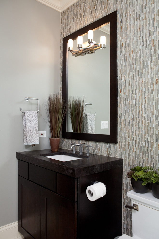 Large contemporary master bathroom in Chicago with a drop-in sink, dark wood cabinets, a corner shower, multi-coloured tile, shaker cabinets, a one-piece toilet, glass sheet wall, grey walls, porcelain floors, solid surface benchtops and beige floor.